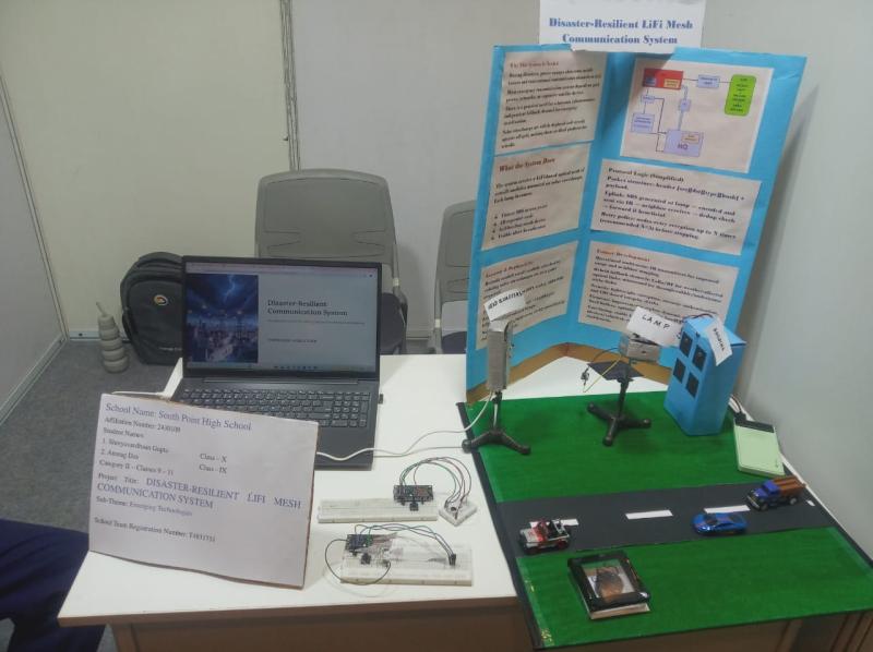 D-LiFi-Proto exhibition table with the mesh-node prototype, laptop demo, and printed project poster