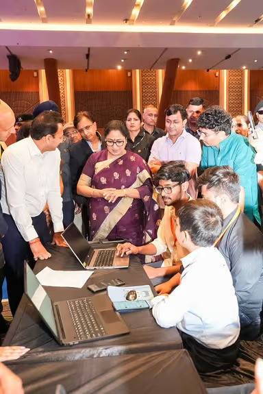 Team demoing SarkarSathi on laptops to West Bengal officials at the India Innovates 2026 exhibition